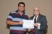 Dr. Nagib Callaos, General Chair, giving Prof. Walter Mata the best paper award certificate of the session "Sistemas/Tecnologías de Comunicaciones y Redes y sus Aplicaciones." The title of the awarded paper is "Arquitectura Embebida de Tiempo Real para Sistemas Domóticos."